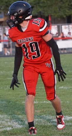 Trojans football player in the new red uniform