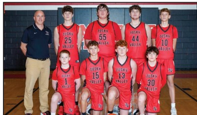 Middle school boys basketball team and coach in red Tusky Valley uniforms